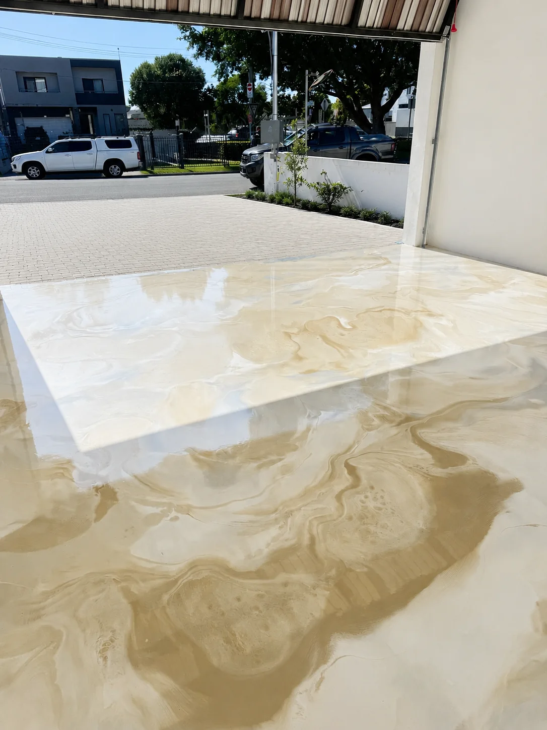Cream metallic marble garage floor and entry steps